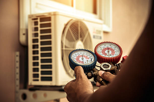 Professional Hvac technician working in Butlerville, IN